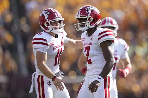 Louisiana Lafayette quarterback Zeon Chriss (2) celebrates after throwing for a touchdown during the first half of an NCAA college football game against Minnesota, Saturday, Sept. 30, 2023, in Minneapolis. (AP Photo/Abbie Parr)