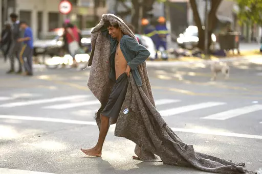 A homeless man crosses a street in an area occupied by drug users known as Crackland, in downtown Sao Paulo, Brazil, May 11, 2023. The decline of Sao Paulo's downtown area has accelerated over the last year, where crack users seem to be everywhere, roaming the central streets of South America's biggest city. (AP Photo/Andre Penner, File)