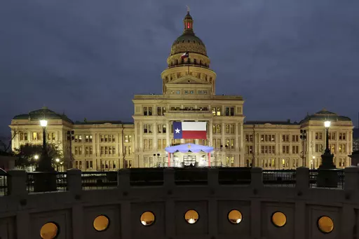 In this Jan. 14, 2019 file photo, a large Texas flag hangs from the Texas State Capitol in Austin, Texas. A federal judge has struck down a Texas law requiring age verification and health warnings to view pornographic websites and blocked the state attorney general's office from enforcing it. U.S. District Judge David Ezra on Thursday, Aug. 31, 2023 agreed with claims that the bill signed into law by Gov. Greg Abbott in June violates free speech rights, is overbroad and vague.(AP Photo/Eric Gay,
