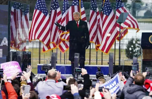 In this Jan. 6, 2021, photo, President Donald Trump arrives to speak at a rally in Washington. A federal judge on Feb. 18, 2022, rejected efforts by the former president to toss out lawsuits filed by lawmakers and two Capitol police officers, saying in his ruling that the former president's words "plausibly" may have led to the Jan. 6, 2021 insurrection. (AP Photo/Jacquelyn Martin, File)