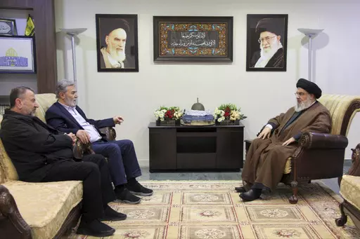 In this photo released on Oct. 25, 2023, by the Hezbollah Media Relations Office, Hezbollah leader Sayyed Hassan Nasrallah, right, meets with Ziad al-Nakhleh, the head of Palestinian Islamic Jihad, center, and Hamas deputy chief, Saleh al-Arouri, in Beirut. When the Lebanese militia Hezbollah announced last week that its leader Hassan Nasrallah would deliver his first public speech since the outbreak of the Israel-Hamas war, much of the region held its breath. (Hezbollah Media Relations Office, 