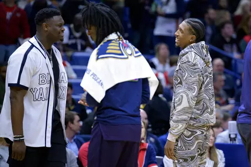 Newly acquired New Orleans Pelicans guard Josh Richardson, right, smiles at forward Zion Williamson, left, in the first half of an NBA basketball game against the Cleveland Cavaliers in New Orleans, Friday, Feb. 10, 2023. (AP Photo/Matthew Hinton)