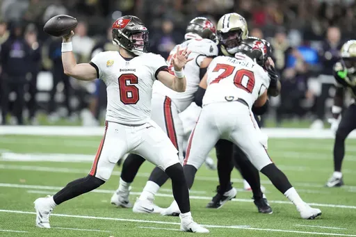 Tampa Bay Buccaneers quarterback Baker Mayfield (6) passes against the New Orleans Saints during the first half of an NFL football game in New Orleans, Sunday, Oct. 13, 2024. (AP Photo/Michael Conroy)