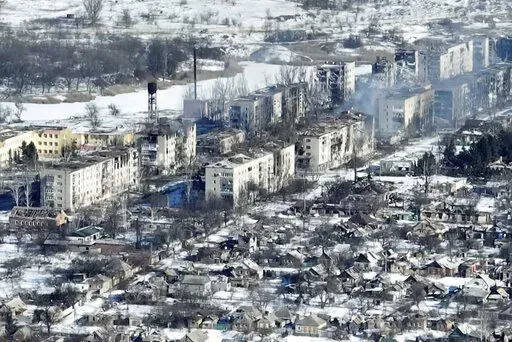 New video footage of Bakhmut shot from the air with a drone for The Associated Press shows how the longest battle of the year-long Russian invasion has turned the city of salt and gypsum mines in eastern Ukraine into a ghost town. The footage was shot Feb. 13. From the air, the scale of destruction becomes plain to see. Entire rows of apartment blocks have been gutted, just the outer walls left standing and the roofs and interior floors gone, exposing the ruins’ innards to the snow and winter 
