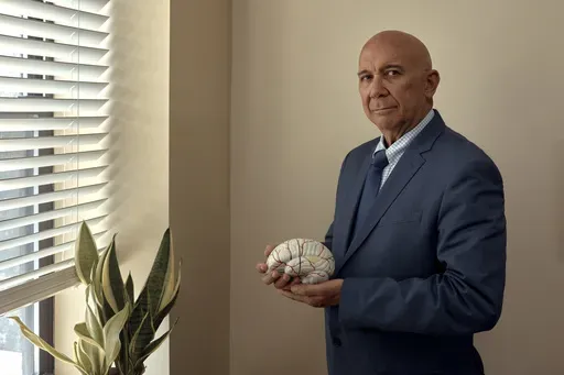 Dr. Fernando Taveras, a psychiatrist and Hispanic mental healthcare expert with SOMOS Community Care Clinic, stands for a portrait in New York on Wednesday, July 3, 2024. Mental health experts, community clinics and politicians are working to create new programs to break down barriers that Latinos might face to getting therapy or treatment. (AP Photo/Andres Kudacki)