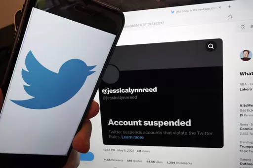 This Thursday, May 11, 2023, image taken in New York, shows the account suspended notice of Jessica Reed on the Twitter page of her younger sister Emily Reed. On Monday, May 8, 2023, Twitter CEO Elon Musk announced the platform would be "purging accounts that have had no activity at all for several years." The news caused outrage among people fearing they could lose tweets that now-inactive accounts, including those belonging to users who have died, left behind on the app. (AP Photo/Richard Drew