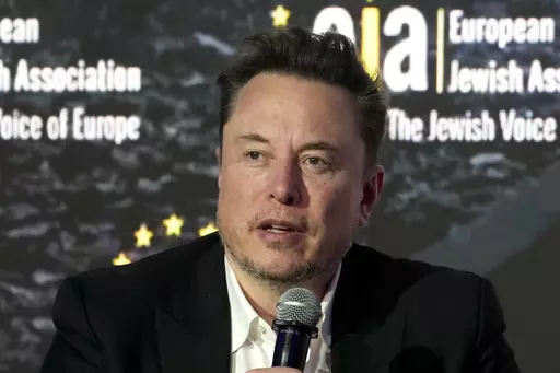 Elon Musk addresses the European Jewish Association's conference, in Krakow, Poland, Monday, Jan. 22, 2024. Musk is suing OpenAI and its CEO Sam Altman, Thursday, Feb. 29, over what he says is a betrayal of the ChatGPT maker's founding aims of benefiting humanity rather than pursuing profits. (AP Photo/Czarek Sokolowski, File)