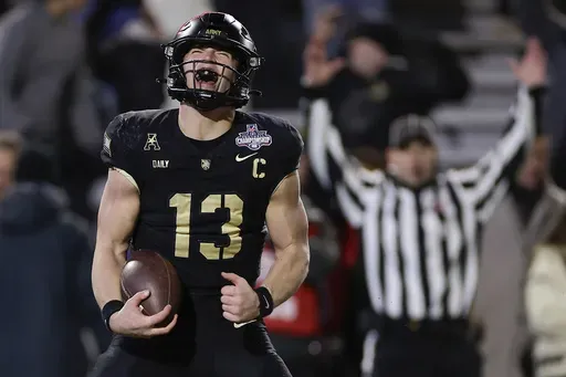 Army quarterback Bryson Daily (13) reacts after scoring a touchdown against Tulane during the first quarter of an NCAA college football game, Friday, Dec. 6, 2024, in West Point, N.Y. (AP Photo/Adam Hunger)
