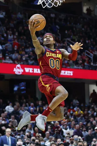 Cleveland Cavaliers' Brandon Goodwin (00) scores against New Orleans Pelicans during the second half of an NBA basketball game, Monday, Jan. 31, 2022, in Cleveland. (AP Photo/Ron Schwane)
