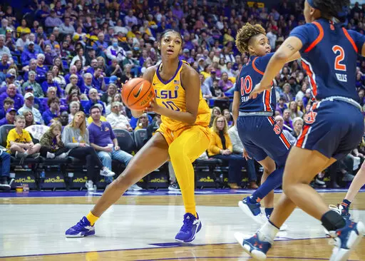 LSU's Angel Reese, left, looks to shoot against Auburn during an NCAA college basketball game in Baton Rouge, La., Sunday, Jan. 15, 2023. (Scott Clause/The Daily Advertiser via AP)