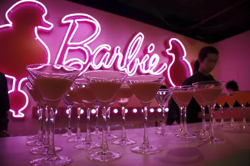 Barbie cocktails are prepared for guests at the opening ceremony of Barbie Shanghai flagship store, March 6, 2009, in Shanghai, China. The color pink has long been associated with the Barbie brand — she even has her own Pantone color. (AP Photo/Eugene Hoshiko, File)