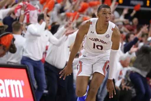 Auburn forward Jabari Smith (10) reacts after making a 3-pointer against Alabama during the first half of an NCAA college basketball game Tuesday, Feb. 1, 2022, in Auburn, Ala. Houston, Detroit and Orlando share the best odds to win the draft lottery on Tuesday, May 17, 2022, and the No. 1 pick in the NBA draft. All three are already loaded with young players, even before the possibility of adding someone like Chet Holmgren, Paolo Banchero or Jabari Smith. (AP Photo/Butch Dill, File)