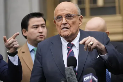 Rudy Giuliani speaks to reporters as he leaves the federal courthouse in New York, Nov. 26, 2024. (AP Photo/Seth Wenig, File)
