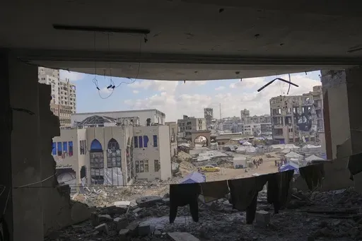 A view of the Islamic University in Gaza City, partially damaged by an Israeli bombardment and now serving as a shelter for displaced Palestinians amid the ongoing conflict in Gaza, Saturday, April 5, 2025. (AP Photo/Jehad Alshrafi)