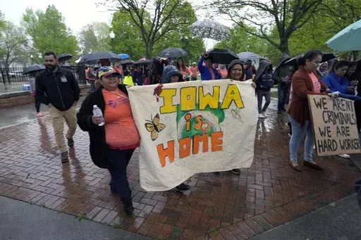 People march during an Iowa Movement for Migrant Justice rally and march, Wednesday, May 1, 2024, in Des Moines, Iowa. A federal judge on Monday temporarily blocked an Iowa law that allows law enforcement in the state to file criminal charges against people with outstanding deportation orders or those who previously had been denied entry to the United States. (AP Photo/Charlie Neibergall, File)