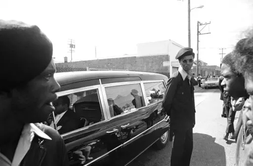 Black Panthers stand guard on Aug. 28, 1971, in Oakland, Calif., while the hearse carrying the body of George Jackson was brought to St. Augustine's Episcopal Church. First celebrated in 1979, Black August was originally created to commemorate Jackson's fight for Black liberation. Fifty one years since his death, Black August is now a month-long awareness campaign and celebration dedicated to Black American freedom fighters, revolutionaries, radicals and political prisoners, both living and dece