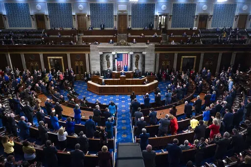President Joe Biden delivers his first State of the Union address to a joint session of Congress at the Capitol, Tuesday, March 1, 2022, in Washington.  On Friday, March 18, The Associated Press reported on stories circulating online incorrectly claiming members of Congress gave themselves a 21% pay raise in early March.(Jim Lo Scalzo/Pool via AP, File)