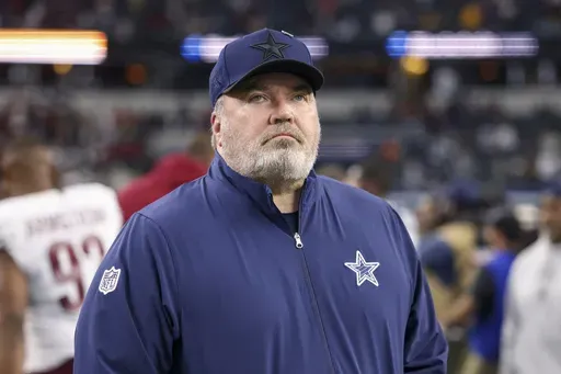 Dallas Cowboys head coach Mike McCarthy walks on the field following an NFL football game against the Washington Commanders, Sunday, Jan. 5, 2025, in Arlington, Texas. The Commanders won 23-19. (AP Photo/Gareth Patterson)