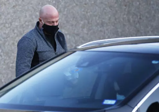 Retired Air Force officer Larry Rendall Brock Jr. walks out of Parker County Jail upon release on Jan. 14, 2021, in Weatherford, Texas. Brock, who stormed the U.S. Capitol dressed in combat gear and carried zip-tie handcuffs into the Senate gallery, was sentenced to two years in prison on Friday, March 17, 2023. Brock joined other rioters on the Senate floor only minutes after then-Vice President Mike Pence, senators and their staff evacuated the chamber to escape the mob attacking the building 