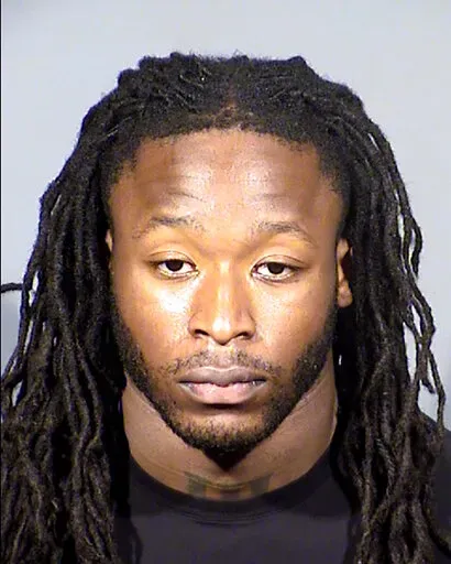 This Clark County, Nev., Detention Center booking photo shows New Orleans Saints running back Alvin Kamara following his arrest on Feb. 6, 2022, in Las Vegas. A judge has postponed a hearing in a felony assault case against Kamara, Kansas City Chiefs cornerback Chris Lammons and two other defendants until Aug. 1, 2022.  (Clark County Detention via AP, File)
