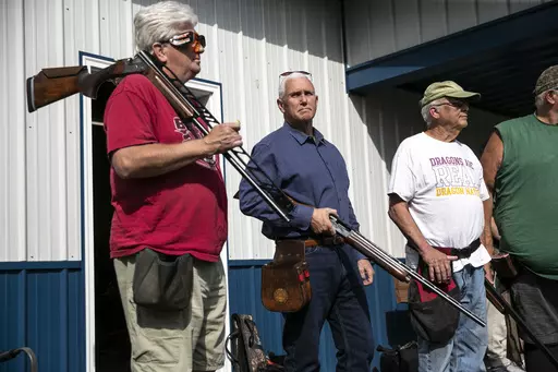 Former Vice President and current 2024 Republican presidential candidate Mike Pence receives safety instructions before his turn to shoot during the 10th annual Jasper County GOP trap shoot on Saturday, Sept. 16, 2023, at Jasper County Gun Club in Newton, Iowa. Four Republican presidential hopefuls, made a campaign stop at the event to speak with constituents and shoot a few rounds. (Geoff Stellfox/The Gazette via AP)