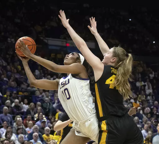 LSU forward Angel Reese (10) drives past Missouri forward Hayley Frank (43) during an NCAA college basketball game Thursday, Jan. 4, 2024, in Baton Rouge, La. As March Madness is set to tip off, three of the most recognizable names in college basketball are in the women’s tournament: Caitlin Clark, Angel Reese and Paige Bueckers.(Hilary Scheinuk/The Advocate via AP, File)