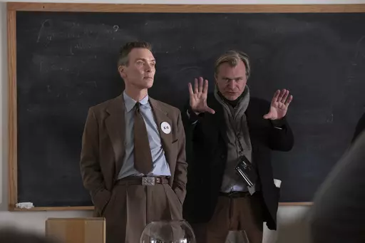 This image released by Universal Pictures shows writer-director-producer Christopher Nolan, right, and actor Cillian Murphy on the set of "Oppenheimer." (Melinda Sue Gordon/Universal Pictures via AP)