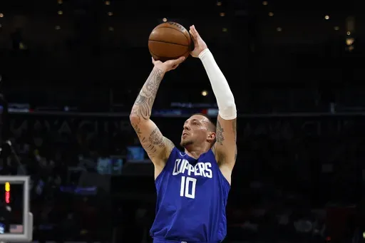 Los Angeles Clippers' Daniel Theis looks to shoot a 3-point basket during the first half of an NBA basketball game against the Utah Jazz, April 5, 2024, in Los Angeles. The New Orleans Pelicans and veteran NBA center Theis have agreed to terms on a one-year contract, a person familiar with the agreement said. The person spoke to The Associated Press on condition of anonymity Monday, July 8, 2024, because the agreement has not been announced. (AP Photo/Etienne Laurent, File)
