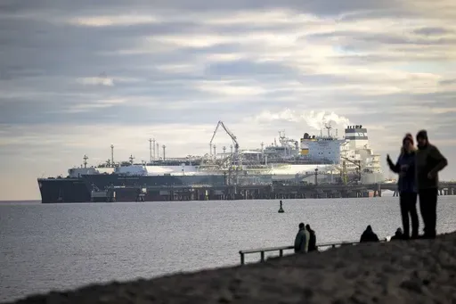 The tanker Maria Energy, left, loaded with liquefied natural gas, is moored at the floating terminal Hoegh Esperanza, in Wilhelmshaven, Germany, Jan. 3, 2023. Attacks by Yemen's Houthi rebels are posing a new threat to the future of energy supplies to the European Union, which relies on imported oil and natural gas to power factories, generate electricity, run vehicles and more. (Sina Schuldt/dpa via AP, file)