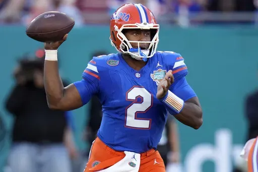 Florida quarterback DJ Lagway (2) throws a pass against Tulane during the first half of the Gasparilla Bowl NCAA college football game Friday, Dec. 20, 2024, in Tampa, Fla. (AP Photo/Chris O'Meara)