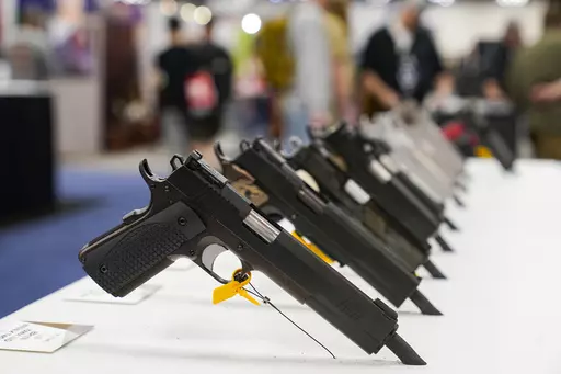 An array of pistols are shown in the Dan Wesson display as guests browse firearms at the National Rifle Association's Annual Meetings & Exhibits in Indianapolis, April 16, 2023. The roster of Republican presidential hopefuls who flocked to the National Rifle Association's annual convention reflects the political potency of gun rights, despite the group's eroding revenues and an opposition movement that's growing increasingly vocal as the drumbeat of mass shootings marches on.(AP Photo/Michael Co