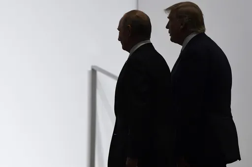 President Donald Trump and Russian President Vladimir Putin walk together at the G20 summit in Osaka, Japan, on June 28, 2019. (AP Photo/Susan Walsh, File)
