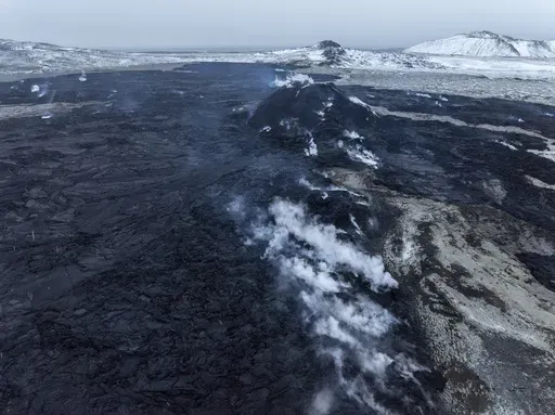 A view of the still steaming fissure from above, in Grindavik on Iceland's Reykjanes Peninsula, Thursday, Dec. 21, 2023. (AP Photo/Marco Di Marco)