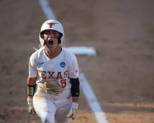 Texas' Bella Dayton celebrates after a home run against Texas A&M in Game 2 of the NCAA college Division I softball tournament super regional in Austin, Texas, Saturday May 25, 2024. (Meredith Seaver/College Station Eagle via AP)
