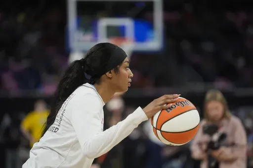 Chicago Sky's Angel Reese warms up before a WNBA basketball game against the Indiana Fever, Friday, Aug. 30, 2024, in Chicago. (AP Photo/Erin Hooley)