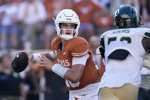 Texas quarterback Arch Manning, left, throws against Colorado State during the second half of an NCAA college football game in Austin, Texas, Saturday, Aug. 31, 2024. (AP Photo/Eric Gay)