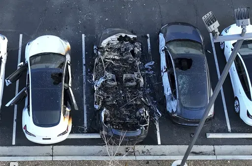 Police are investigating after several vehicles were set on fire at a Tesla service center, Tuesday, March 18, 2025, in Las Vegas. (Bizuayehu Tesfaye/Las Vegas Review-Journal via AP, File)/