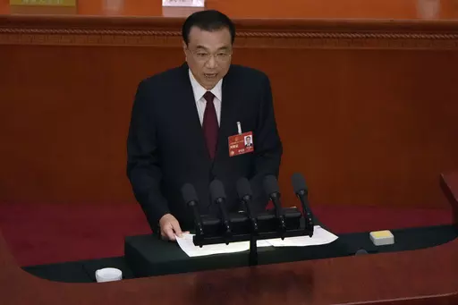 Chinese Premier Li Keqiang delivers his state of the nation address during the opening session of China's National People's Congress (NPC) at the Great Hall of the People in Beijing on March 5, 2023. Chinese state media say former Premier Li Keqiang, China’s top economic official for a decade, has died. (AP Photo/Ng Han Guan, File)
