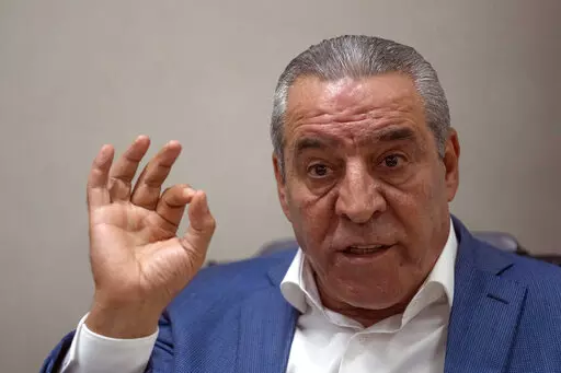 Newly appointed secretary general of the Executive Committee of the Palestine Liberation Organization, PLO, Hussein al-Sheikh gives an interview to The Associate Press, at his office in the West Bank city of Ramallah, Monday, June 13, 2022. Al-Sheikh increasingly seen as a successor to the 86-year-old President Mahmoud Abbas, says relations with Israel have gotten so bad that Palestinian leaders cannot go on with business as usual. (AP Photo/Nasser Nasser)