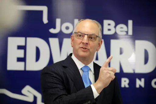 Louisiana Gov. John Bel Edwards talks to media at his campaign office in Shreveport, La., Nov. 14, 2019. Following pleas from Louisiana lawmakers for Edwards to clean up the state’s budget that was hastily passed, the Democrat on Thursday, June 29, 2023, steered a chunk of money away from paying down debt to increase funding for the health department and early childhood education. (AP Photo/Gerald Herbert, File)