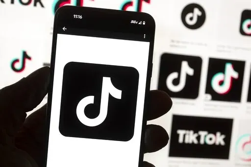 The TikTok logo is seen on a cell phone on Oct. 14, 2022, in Boston. New research finds that TikTok's powerful algorithms are promoting videos about self harm and eating disorders to teens. The findings come from the Center for Countering Digital Hate, which created TikTok accounts for fictitious young people living in the U.S., Britain, Canada and Australia. (AP Photo/Michael Dwyer, File)