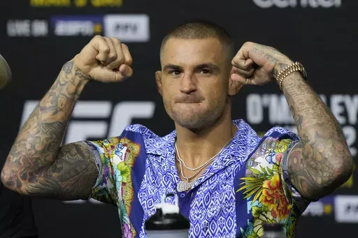 Dustin Poirier poses during a news conference UFC 299 mixed martial arts event, Thursday, March 7, 2024, in Miami. Poirier has won 30 MMA fights overall and has at least one more left - a career-defining bout on a third try at the UFC lightweight championship - against Islam Makhachev in the main event of UFC 302 on Saturday in New Jersey. (AP Photo/Wilfredo Lee, File)