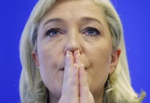 French far right presidential candidate Marine Le Pen attends a party meeting in Nanterre, France, Thursday, Jan. 12, 2012. (AP Photo/Jacques Brinon. File)
