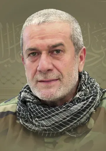 This picture released by Hezbollah media relations office, shows a portrait of Hezbollah commander Mohammad Naameh Nasser, who was killed by an Israeli airstrike that hit his car, in the southern costal town of Tyre, Lebanon, Wednesday, July 3, 2024. The strike took place as global diplomatic efforts have intensified in recent weeks to prevent escalating clashes between Hezbollah and the Israeli military from spiralling into an all-out war that could possibly lead to a direct confrontation betwe