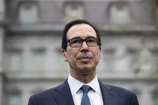 Former Treasury Secretary Steve Mnuchin speaks with reporters at the White House, March 13, 2020, in Washington. Mnuchin is interested in buying TikTok, just days after his investment firm led a $1 billion deal to inject life into a beaten-down bank.(AP Photo/Alex Brandon, File)
