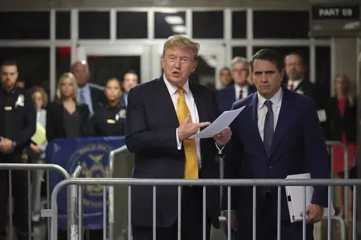 Former President Donald Trump speaks alongside his attorney Todd Blanche following the day's proceedings in his trial Tuesday, May 21, 2024, in Manhattan Criminal Court in New York. (Michael M. Santiago/Pool Photo via AP)