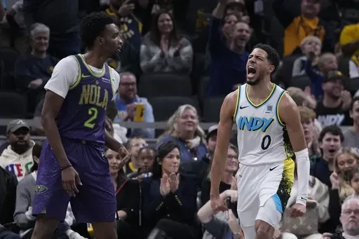 Indiana Pacers' Tyrese Haliburton (0) reacts as New Orleans Pelicans' Herbert Jones (2) walks by during the second half of an NBA basketball game, Sunday, Dec. 15, 2024, in Indianapolis. (AP Photo/Darron Cummings)