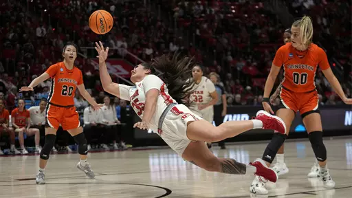 Utah forward Alissa Pili (35) shoots toward the basket as Princeton's Ellie Mitchell (00) and Kaitlyn Chen (20) defend in the first half during a second-round college basketball game in the women's NCAA Tournament, Sunday, March 19, 2023, in Salt Lake City. (AP Photo/Rick Bowmer)