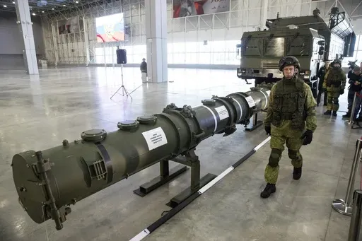 A Russian military officer walks past the 9M729 land-based cruise missile on display in Kubinka outside Moscow, Russia, on Jan. 23, 2019. Russian President Vladimir Putin has called for resuming production of intermediate-range missiles that were banned under a now-scrapped treaty with the US. The Intermediate-Range Nuclear Forces treaty, which banned ground-based missiles with a range of 500-5,500 kilometers (310-3,410 miles) was regarded as an arms control landmark when Soviet leader Mikhail G