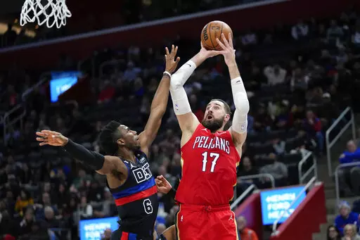 New Orleans Pelicans center Jonas Valanciunas (17) shoots on Detroit Pistons guard Hamidou Diallo (6) in the second half of an NBA basketball game in Detroit, Friday, Jan. 13, 2023. (AP Photo/Paul Sancya)